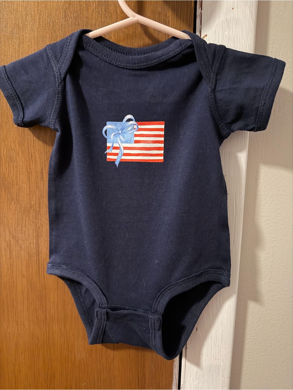 Rabbit Skins Navy One-Piece with Red Striped Flag & Light Blue Bow